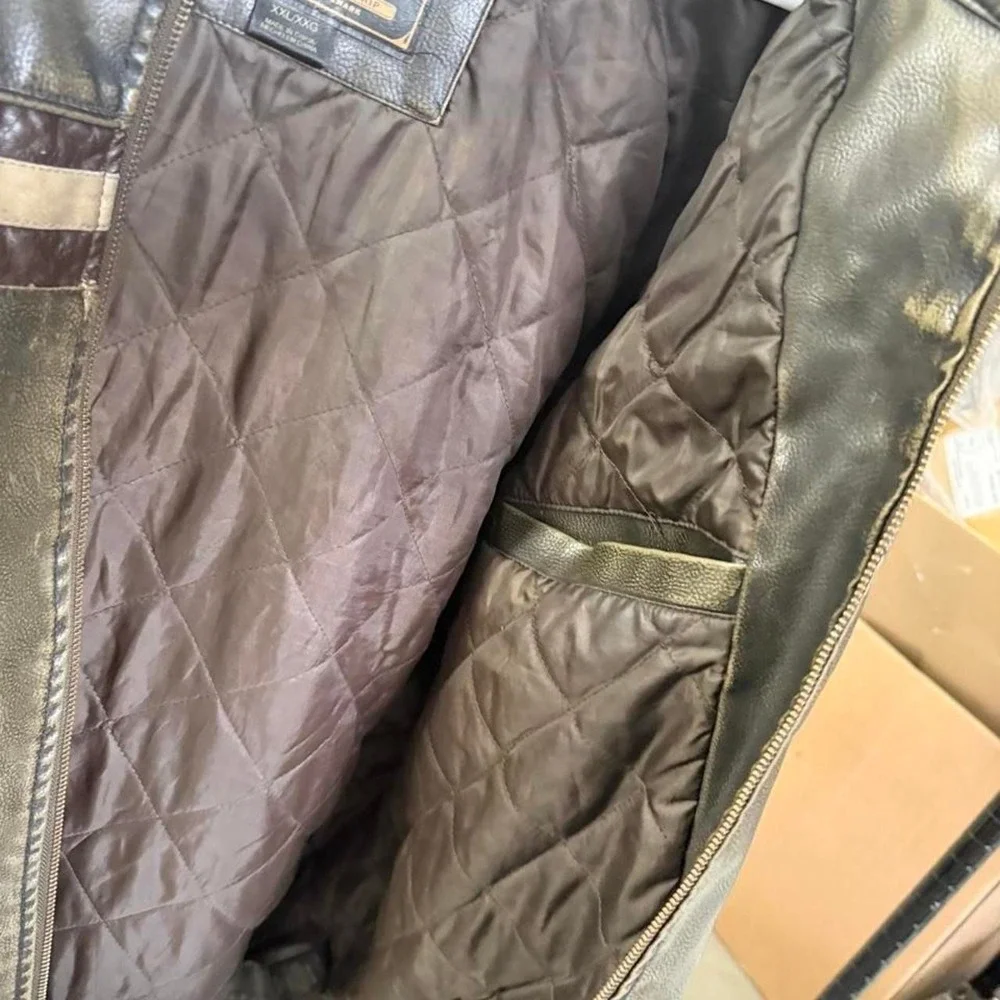 Arizona 90's black leather jacket with two beige stripes across the chest